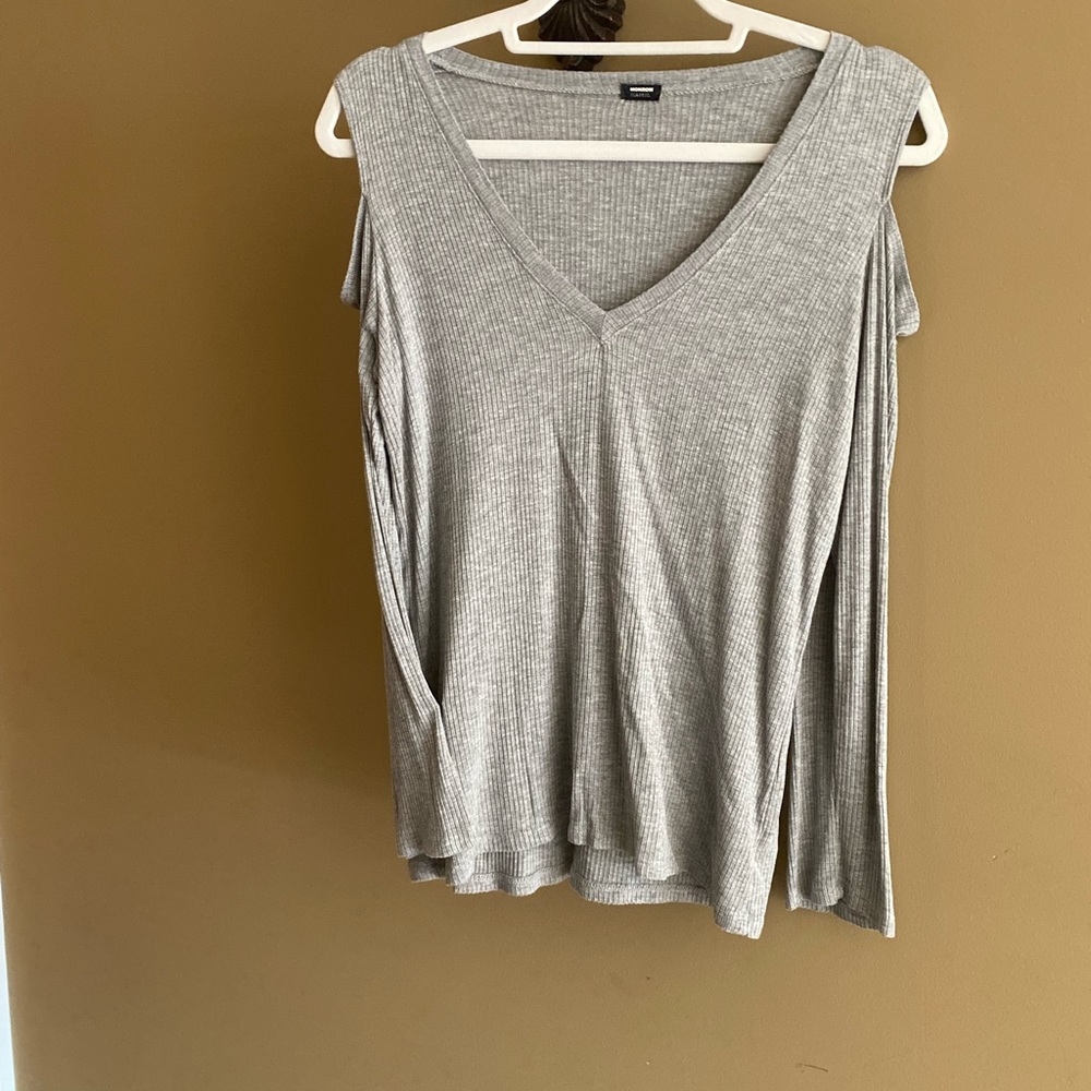 Comfy long sleeve T with cutout shoulders to dress up your every day.